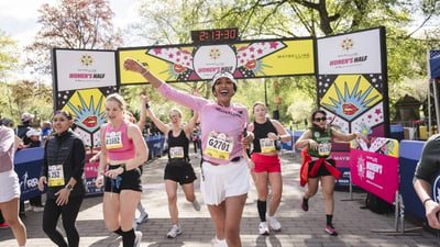 Runners cross the finish line at the Maybelline Women's Half in Central Park