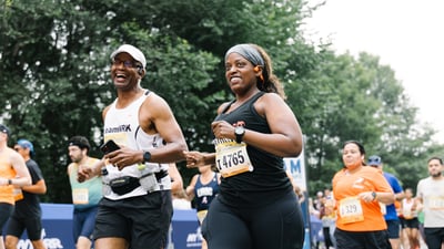Close up of two runners smiling