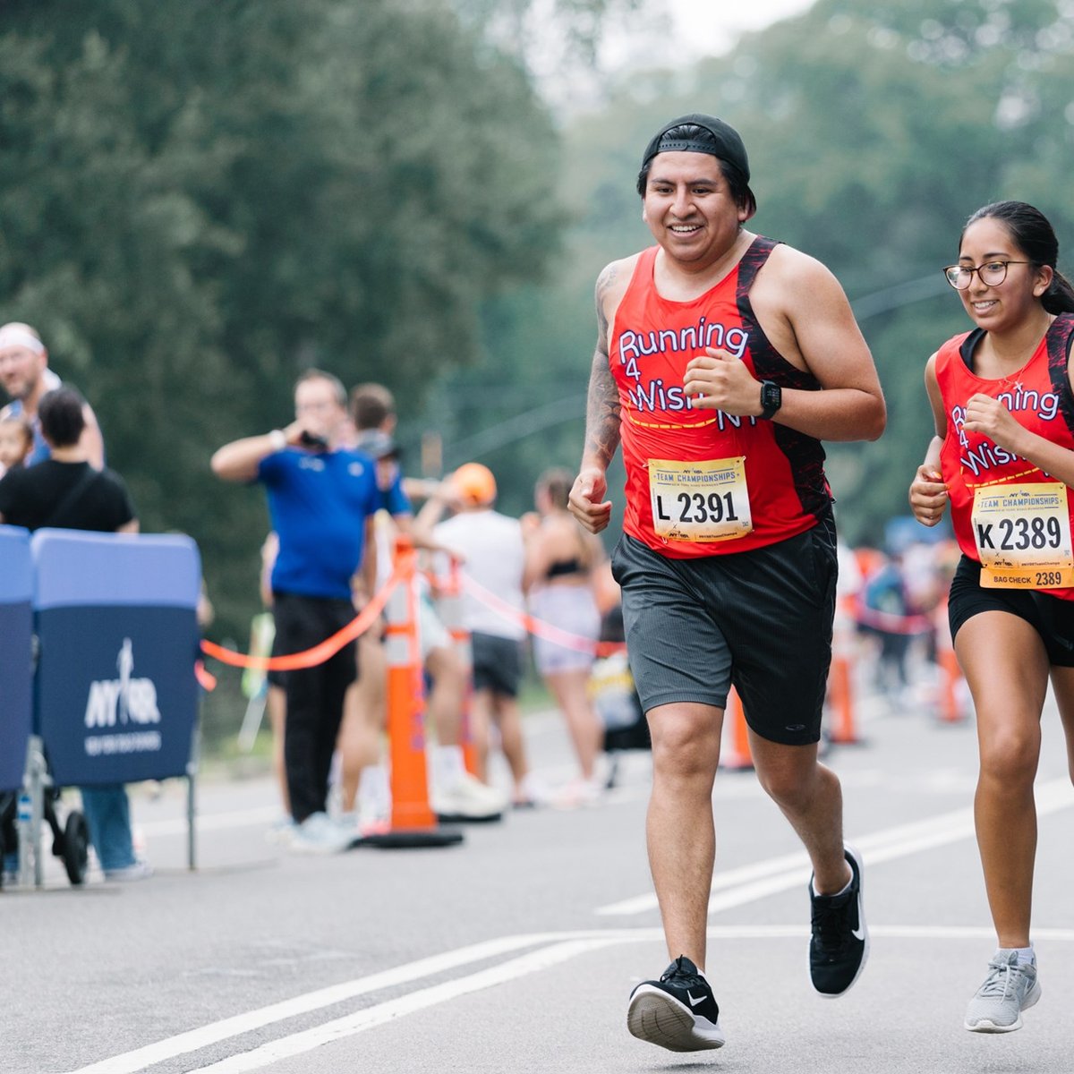 Close up of 2 runners smiling