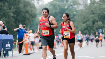 Close up of 2 runners smiling