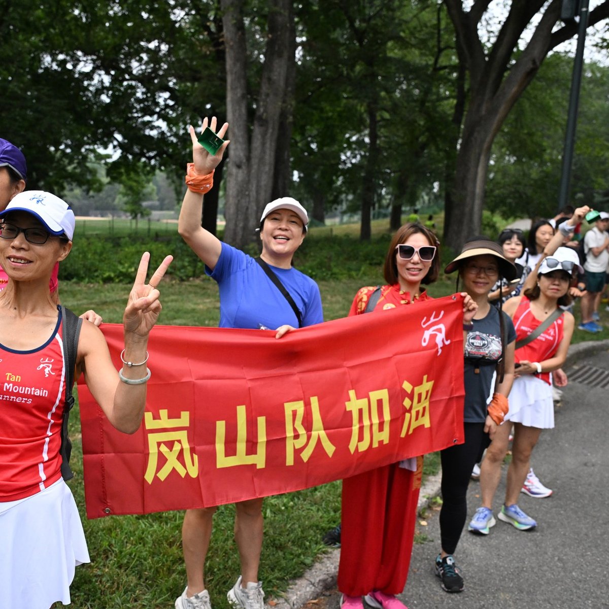 Group shot with sign