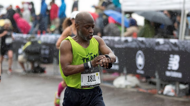 Man checking his watch during the race