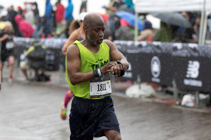 Man checking his watch during the race