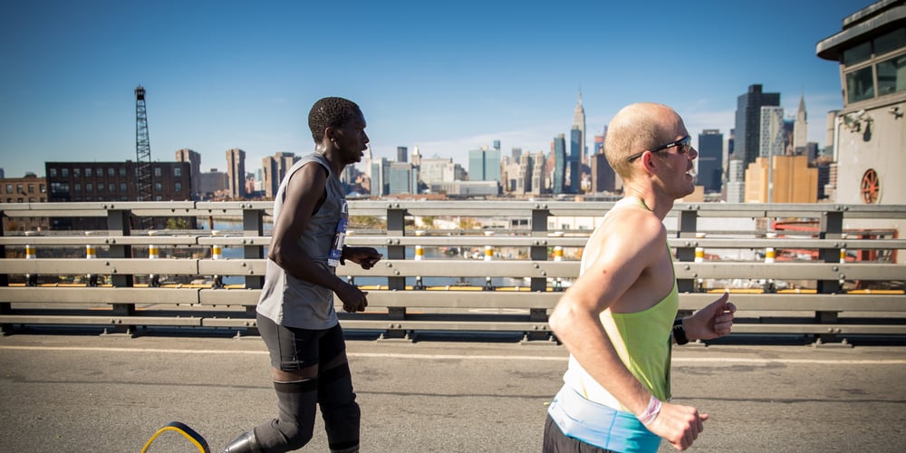 Male runner runs the TCS New York City Marathon with prosthetic legs