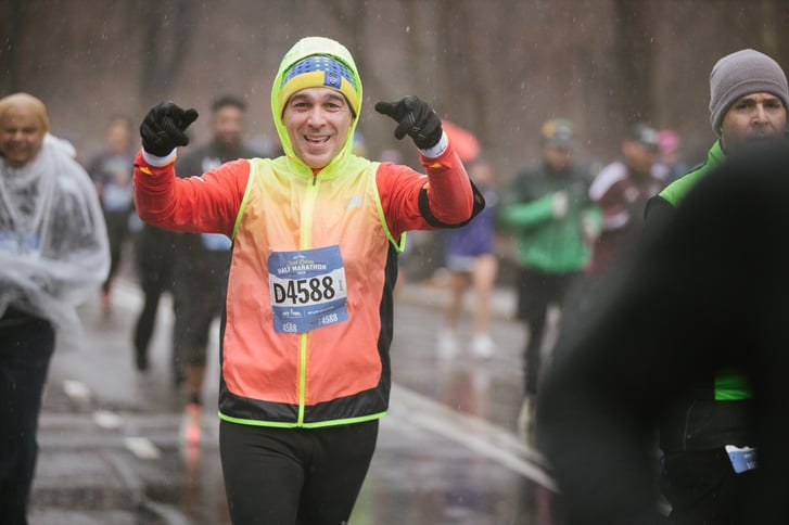 A man running in the rain in Central Park