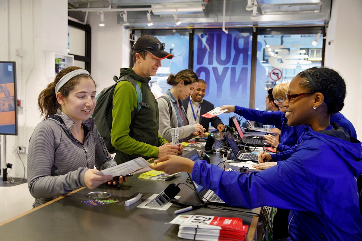 Runners picking up their bibs at the NYRR RunCenter