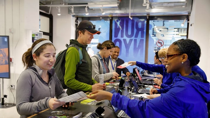 Runners picking up their bibs at the NYRR RunCenter