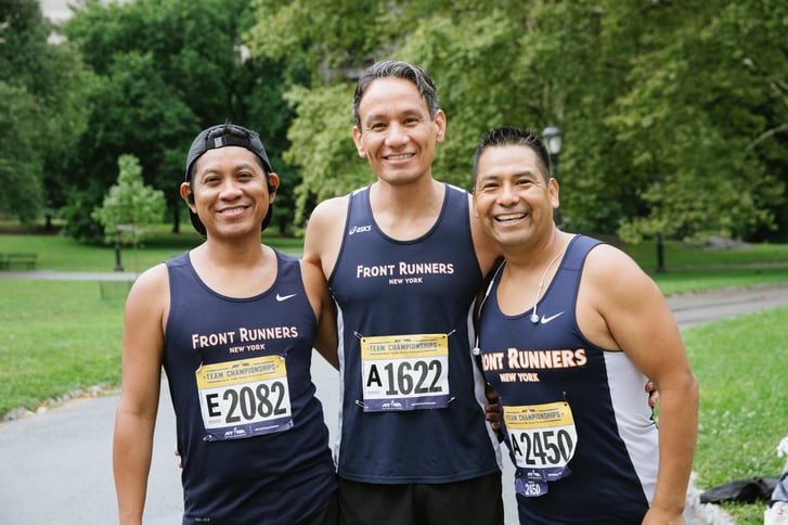 Club runners posing and smiling