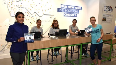 Runners picking up their bib at the NYRR RunCenter
