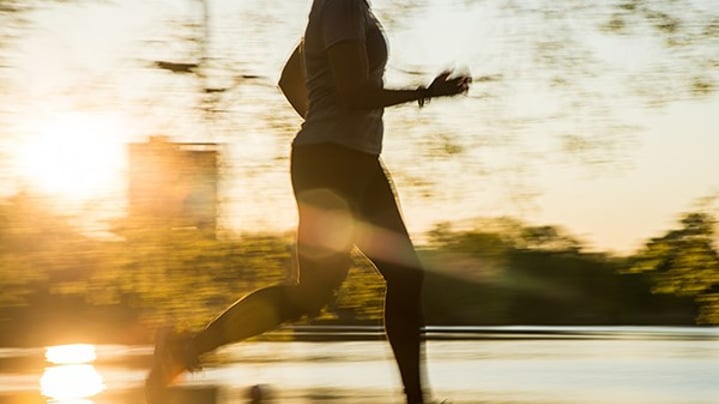 Female running and sunset in Prospect Park Brooklyn