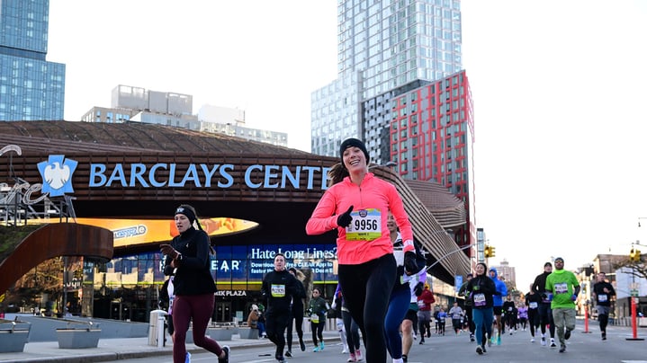 2023 United Airlines NYC Half runners with Barclays Center in background.