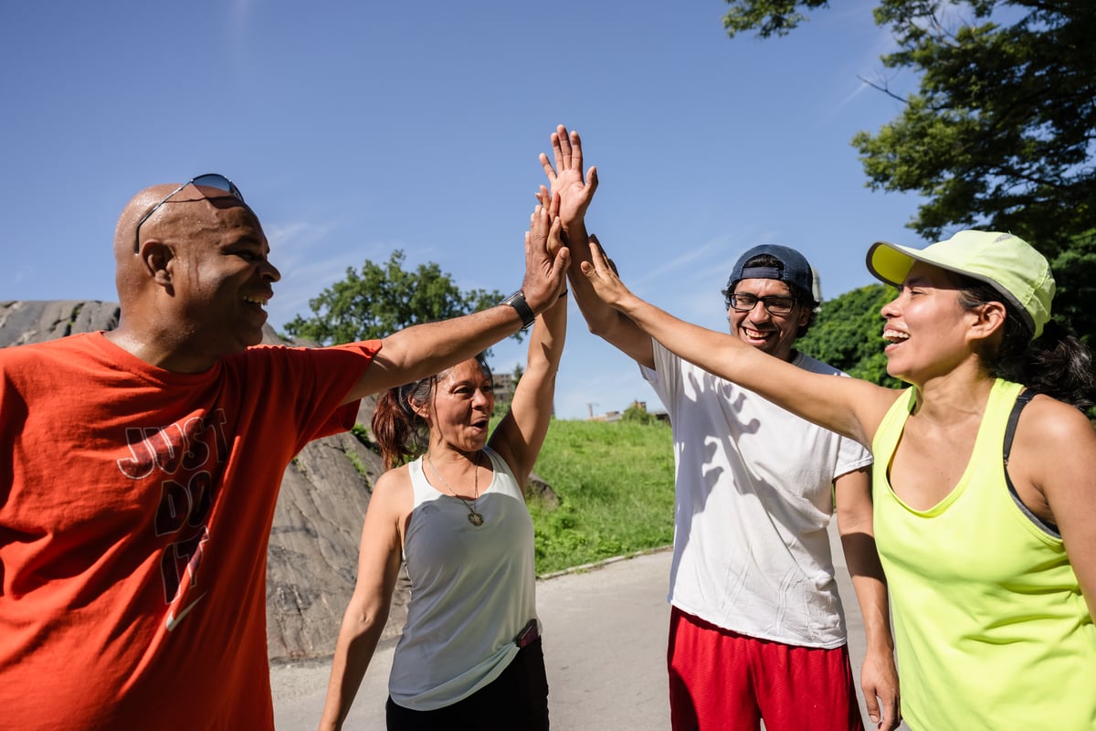 Four runners high-five at St. Mary's Park
