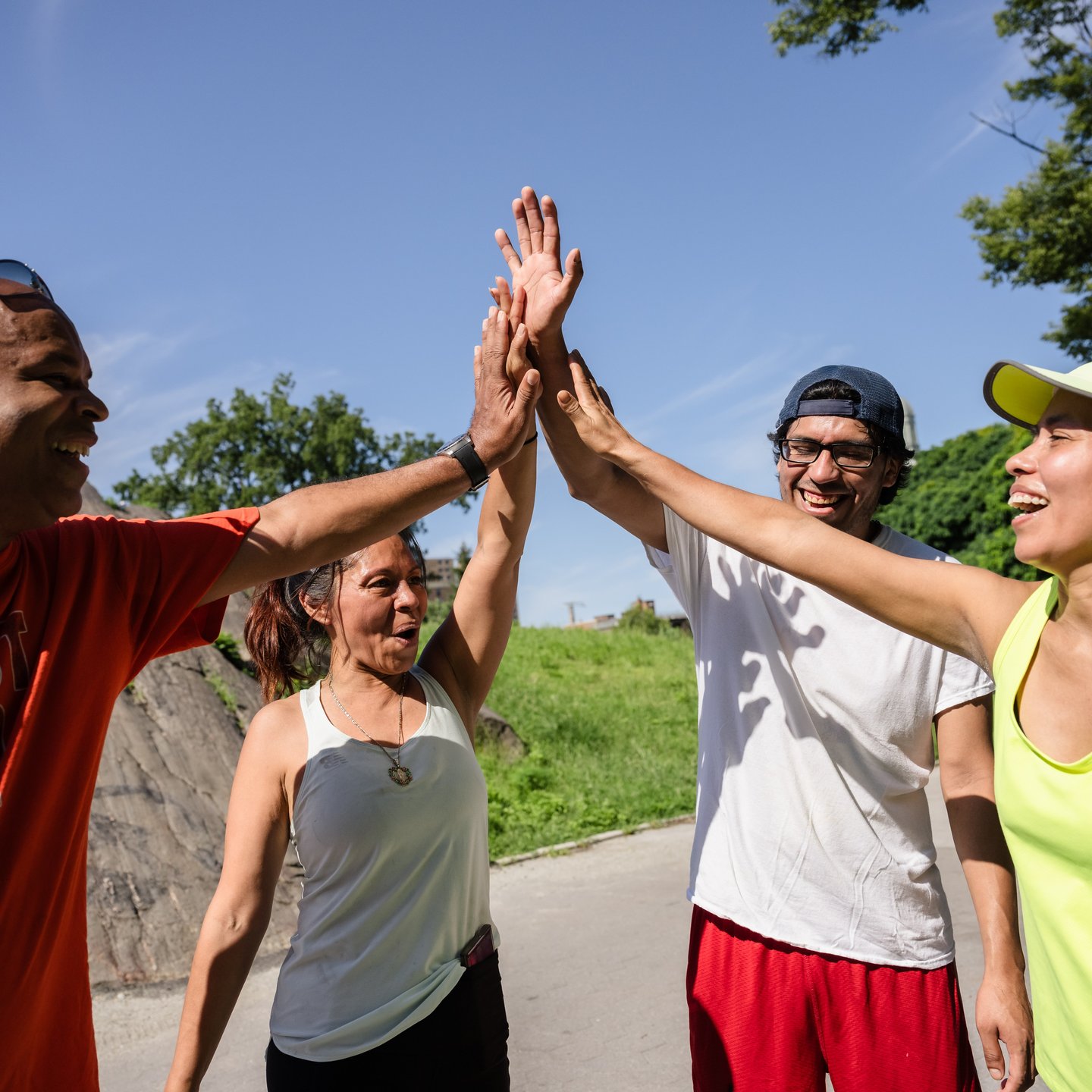 Four runners high-five at St. Mary's Park