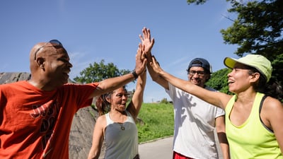 Four runners high-five at St. Mary's Park