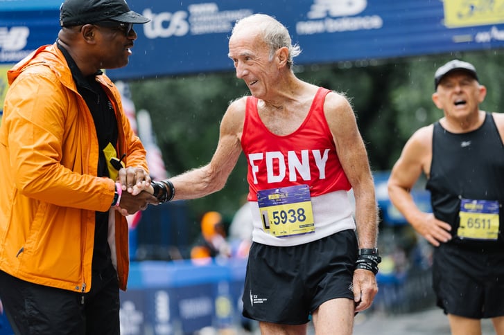 Gary Muhrcke at the New Balance 5th Avenue Mile finish line with Ted Metellus