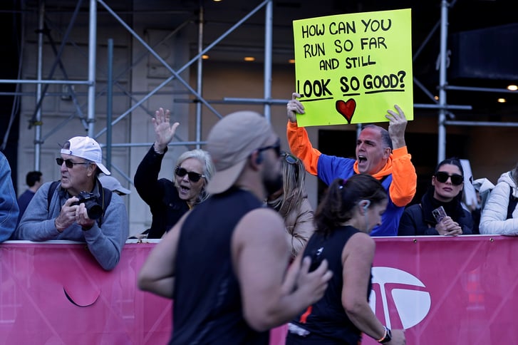 Spectator holding sign at 2024 TCS NYC Marathon