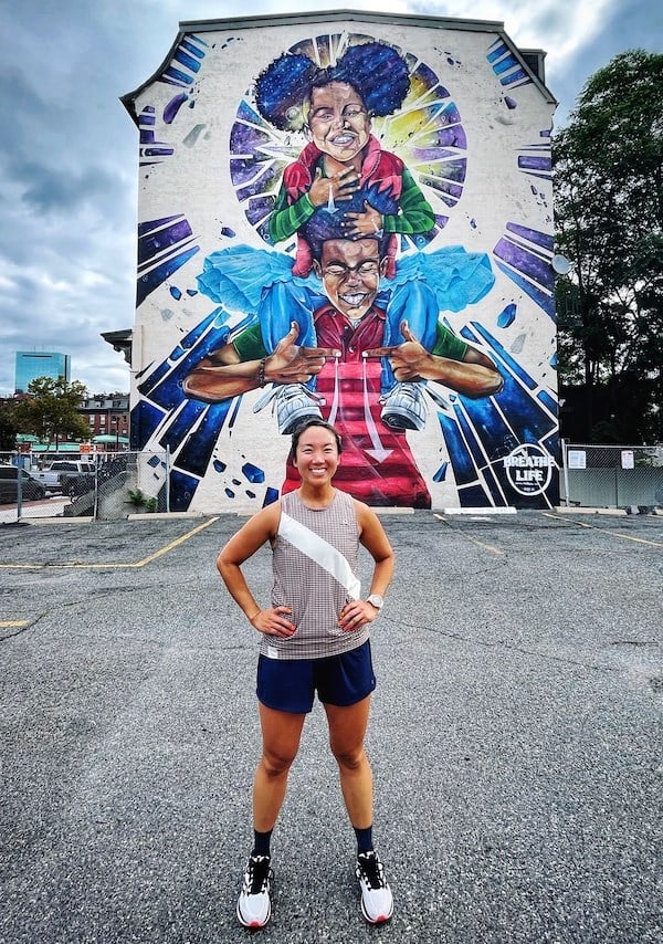 Carolyn with the Breathe Life mural.