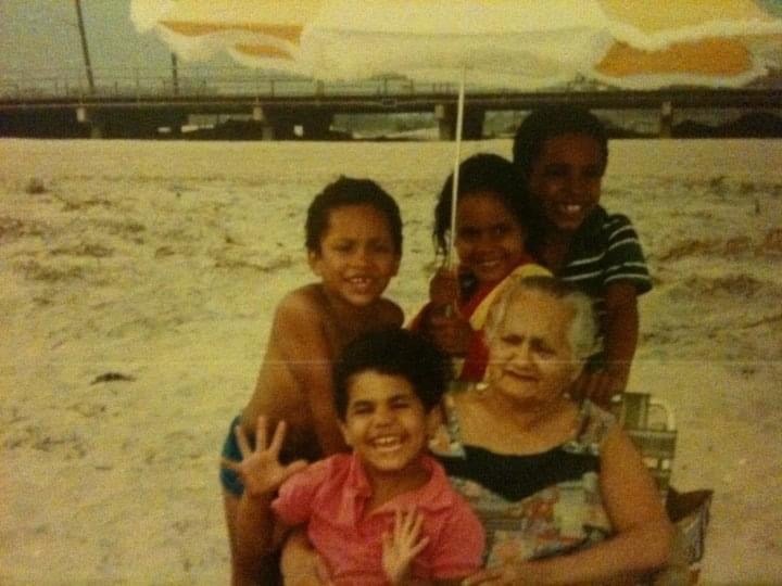 Chasity as a child on the beach with her family.