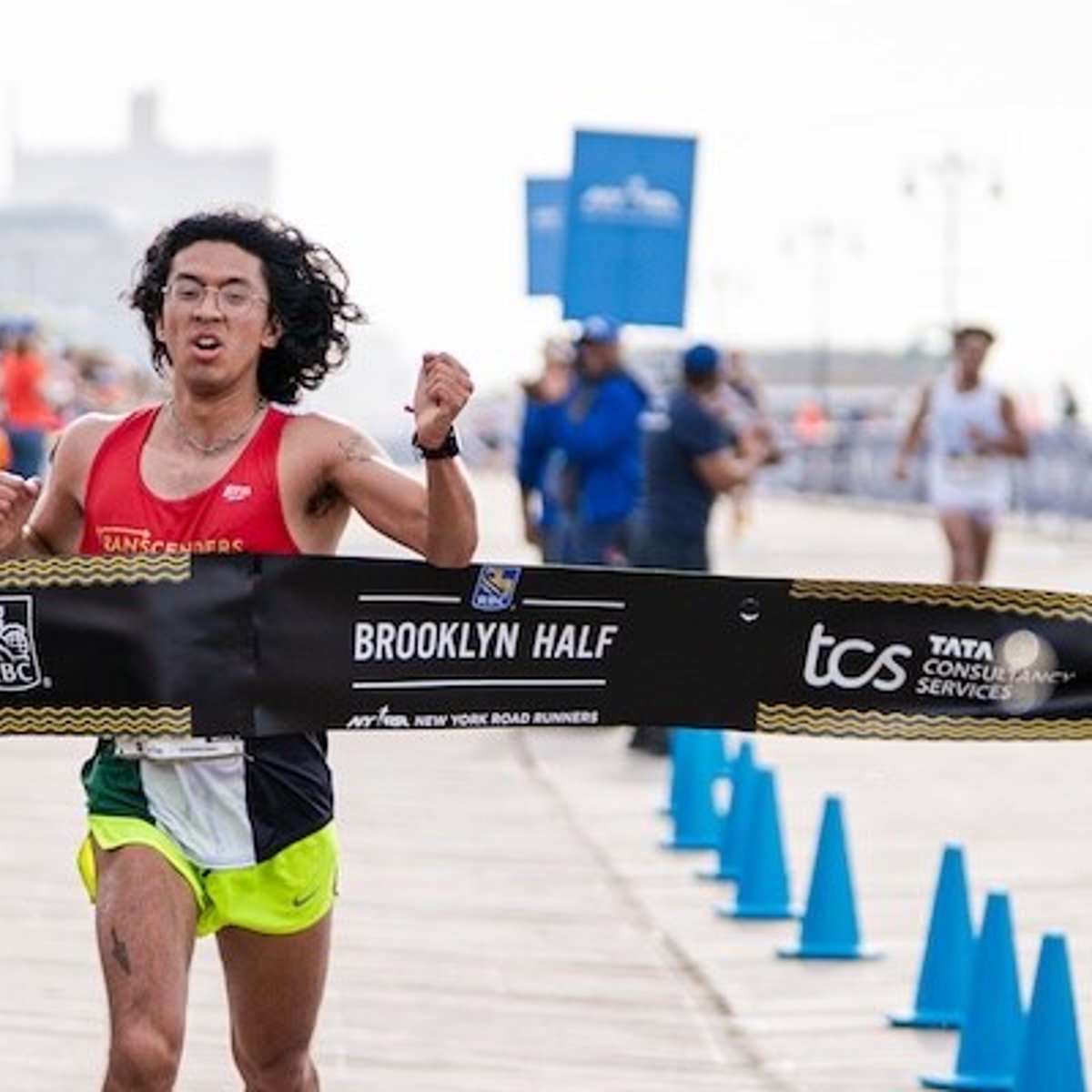 Galo Vasquez crosses the RBC Brooklyn Half finish line in first place as top nonbinary runner.