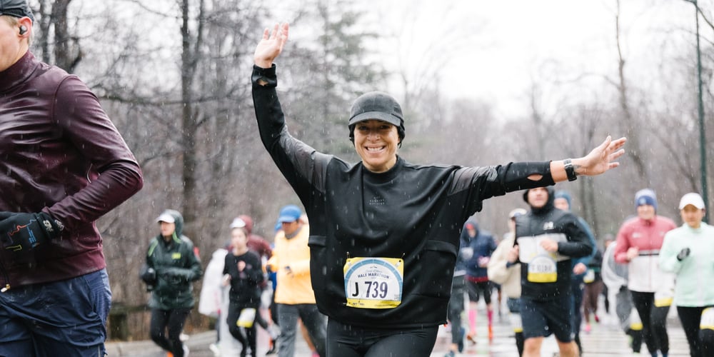 Woman runner dressed in black at 2024 Fred Lebow Half Marathon