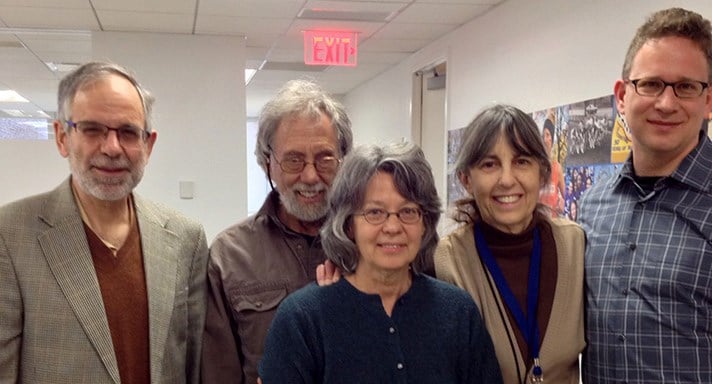 Alice Schneider, center, with NYRR staff including former President Allan Steinfeld (second from left)