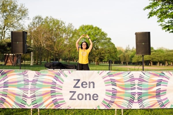 Kristina Lopez leads meditation at the Zen Zone at the NYRR Mindful 5K in Queens.