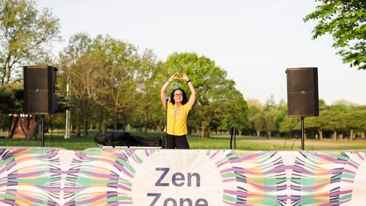 Kristina Lopez leads meditation at the Zen Zone at the NYRR Mindful 5K in Queens.