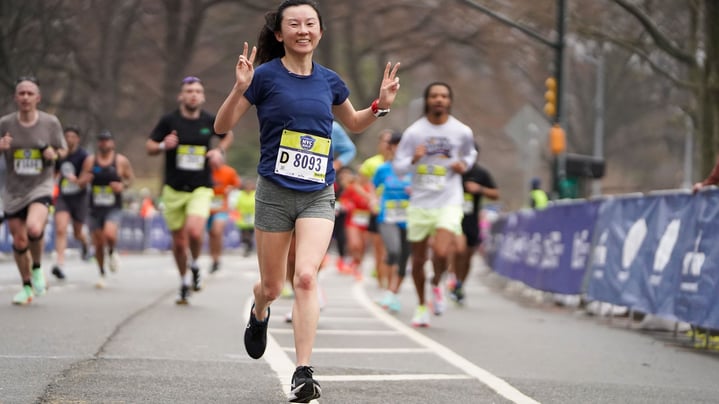 2025 United Airlines NYC Half finisher smiling