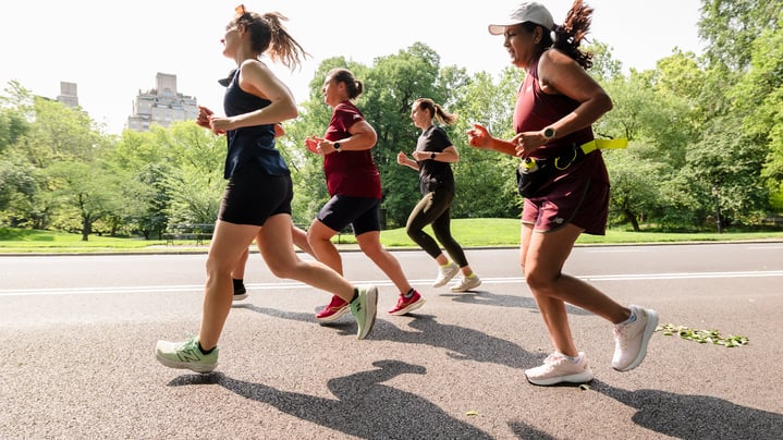 A group of runners in Central Park in 2025 from the side