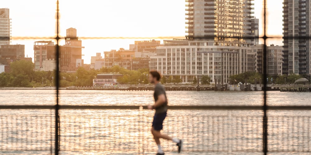 A runner from a distance at the East River Track in Manhattan in 2024