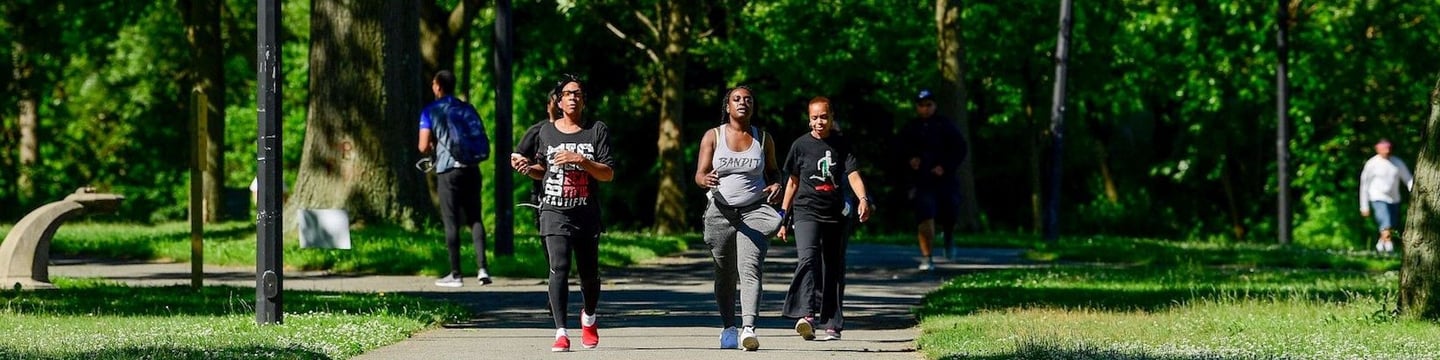 Three runners on a path at Baisley Pond Park
