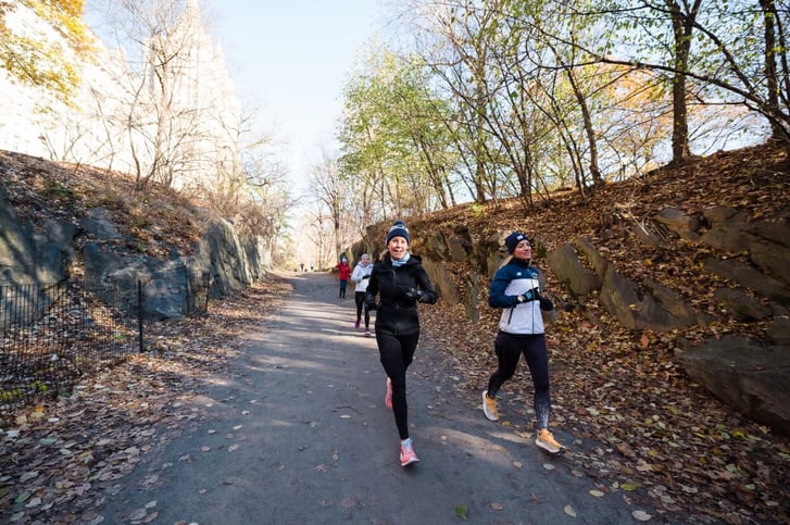 Runners and coaches on bridle path in Central Park.