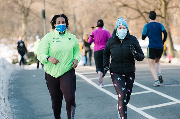 Group Training runner and coach in winter