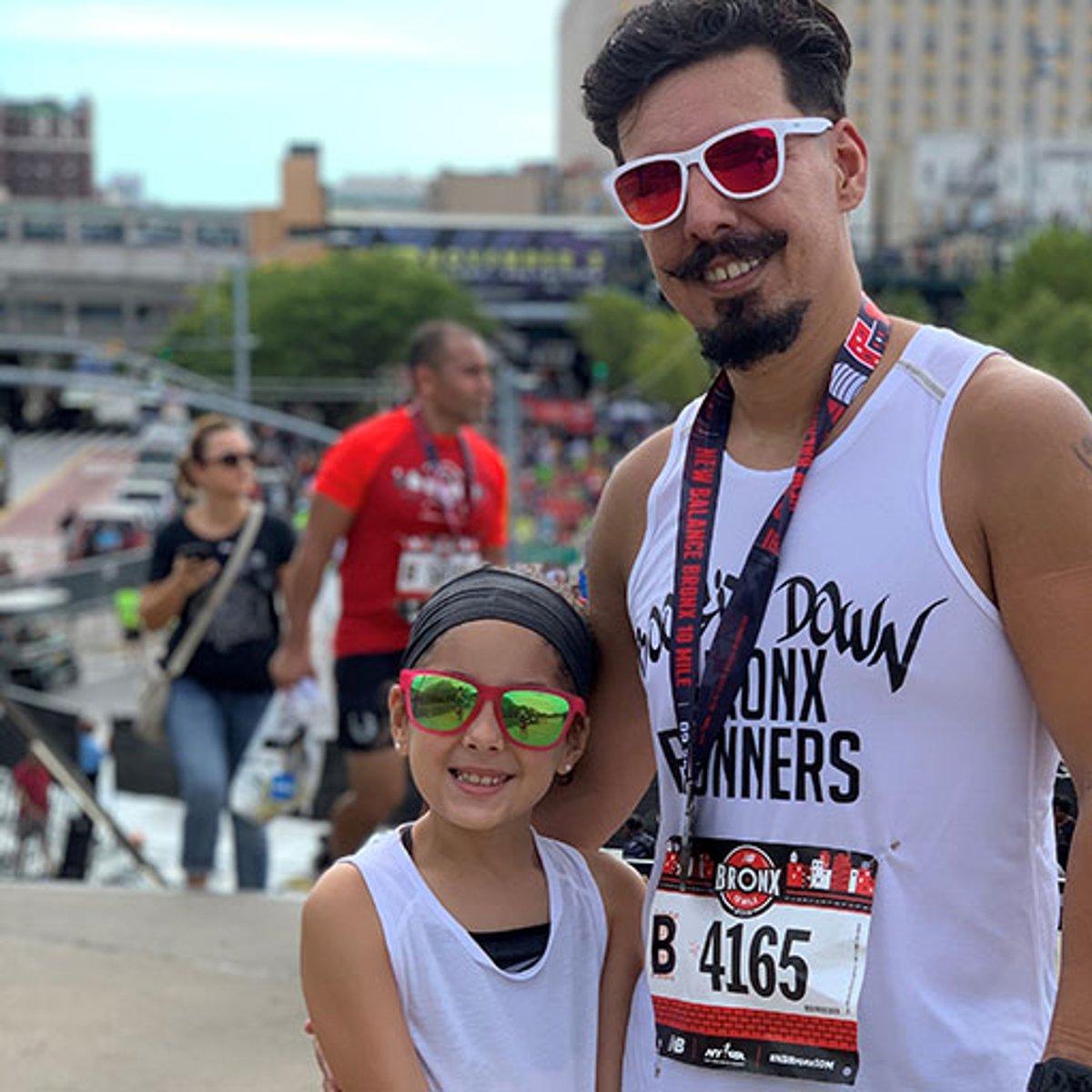 Rising NYRR Kylie and dad at an NYRR race