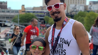 Rising NYRR Kylie and dad at an NYRR race