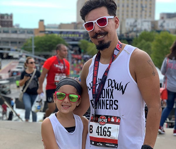Rising NYRR Kylie and dad at an NYRR race