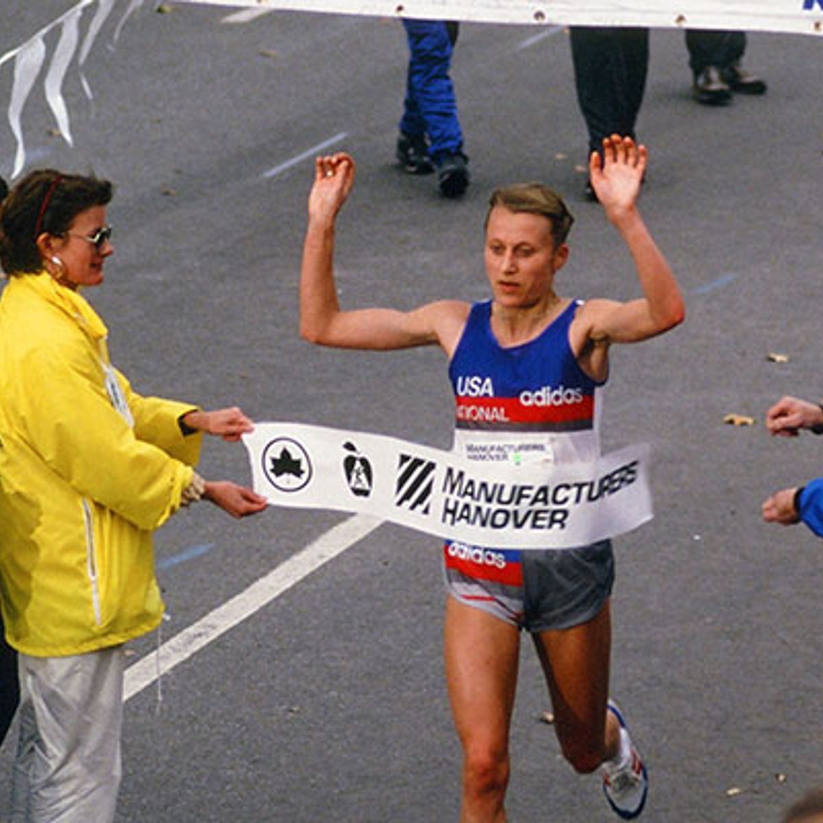 Grete Waitz breaking tape at NYC Marathon