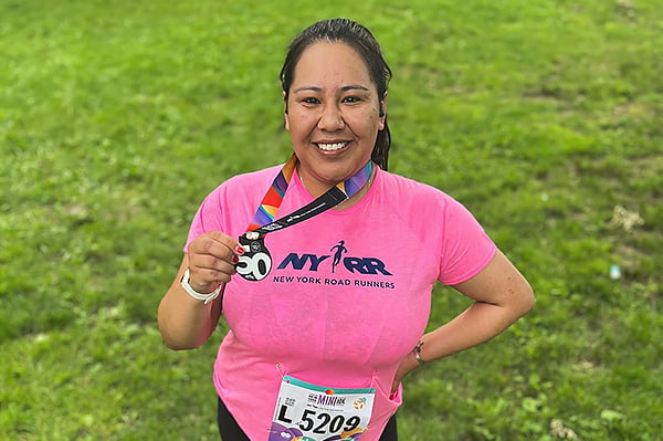 Dinee Dorame in Central Park with Mini medal