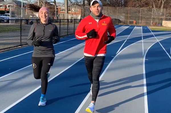 Zak Turner and sister in law running at a track