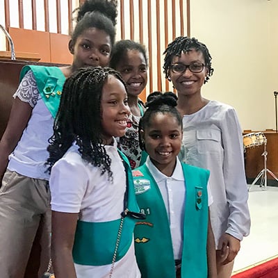 Courtney Lyons and Girl Scouts in a church