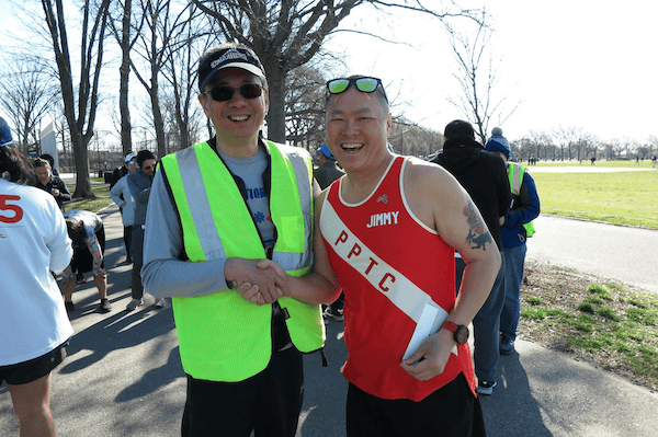 Cliff Open Run volunteer with runner_Half Marathon Day of Giving Post
