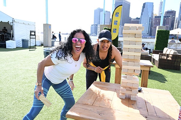 Two women playing jenga at RBC Brooklyn Half Preparty