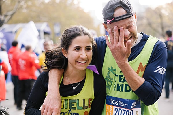TFK runners Mark and Danielle Shapiro cross finish line together.