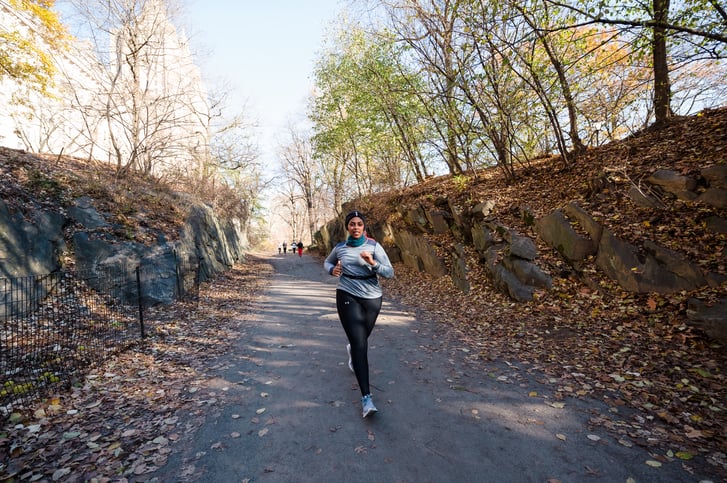 Runner in Central Park on bridle path in cold weather.