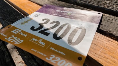 Image of Achilles race bib with braille.