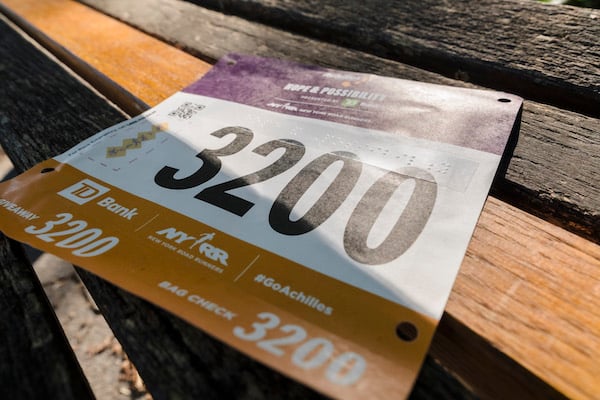 Image of Achilles race bib with braille.