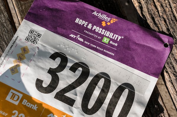 Image of braille on Achilles race bib.