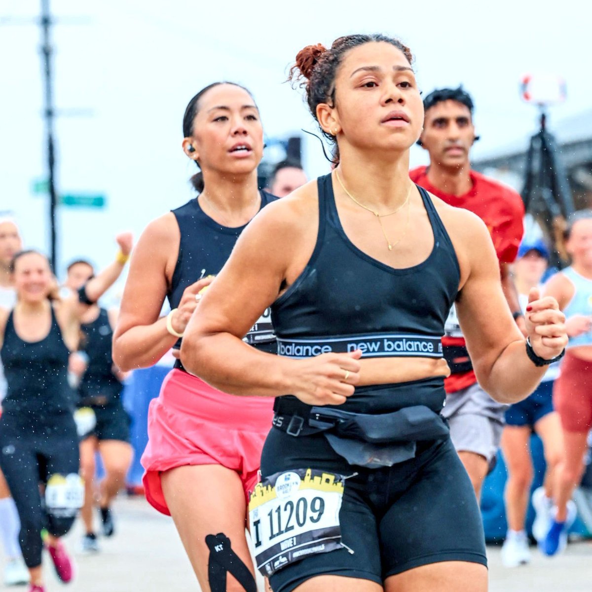 Runner Leesh Menard finishing the 2023 RBC Brooklyn Half on the boardwalk
