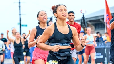 Runner Leesh Menard finishing the 2023 RBC Brooklyn Half on the boardwalk