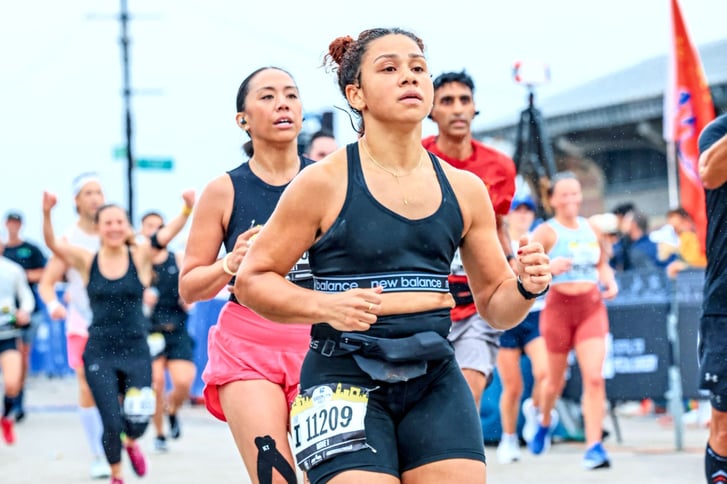Runner Leesh Menard finishing the 2023 RBC Brooklyn Half on the boardwalk